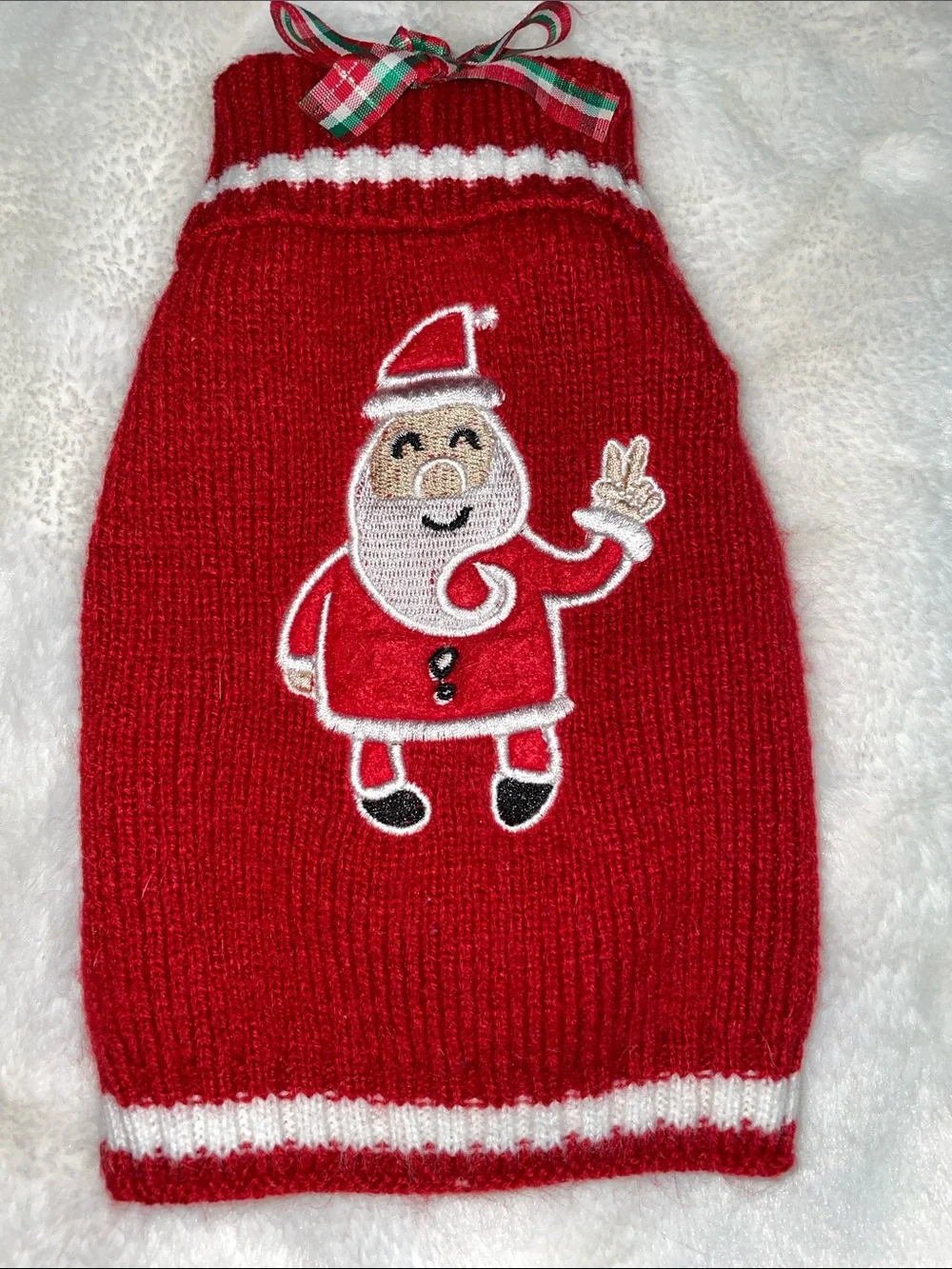 Two dog outfits, size XS…one Christmas sweater & one 4th of July dress